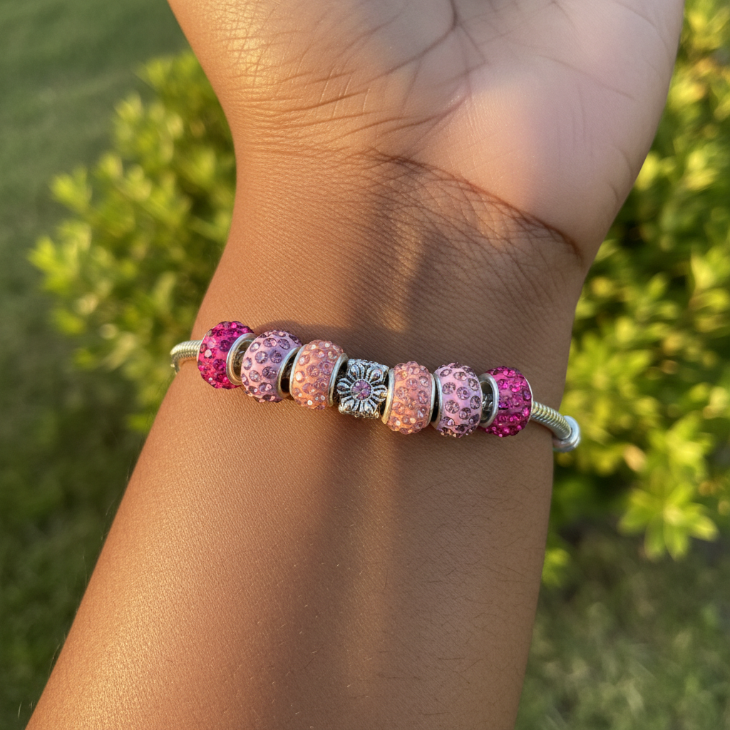 Pink snowflake bracelet on wrist