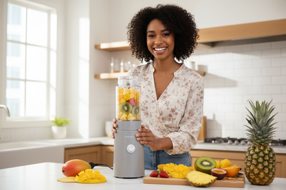 Woman Using Blender in Kitchen